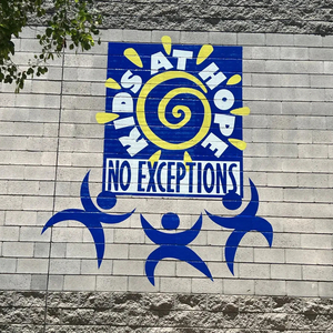Kids at Hope mural on a block wall