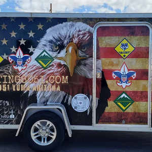 Tow-behind trailer with an eagle and flag graphic wrap